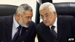 Filistin'in eski Başbakanı Hamas üyesi İsmail Haniye ve El Fetih llderi Devlet Başkanı Mahmud Abbas (2007)