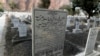 The word "Muslim" has been painted over by vigilantes, on the tombstone of Pakistani scientist Abdus Salam, a member of the Ahmadi community and Pakistan's only Nobel laureate, in the Ahmadi graveyard in the town of Rabwa, Dec. 9, 2013. A recent assassina