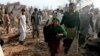 People help victims of a bomb blast in Quetta, Pakistan, Monday, Aug. 8, 2016.