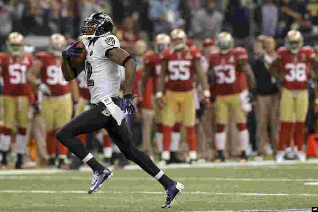 Baltimore Ravens wide receiver Jacoby Jones (12) runs the second-half opening kickoff back for a touchdown against the San Francisco 49ers in the NFL Super Bowl XLVII football game, Sunday, Feb. 3, 2013, in New Orleans.